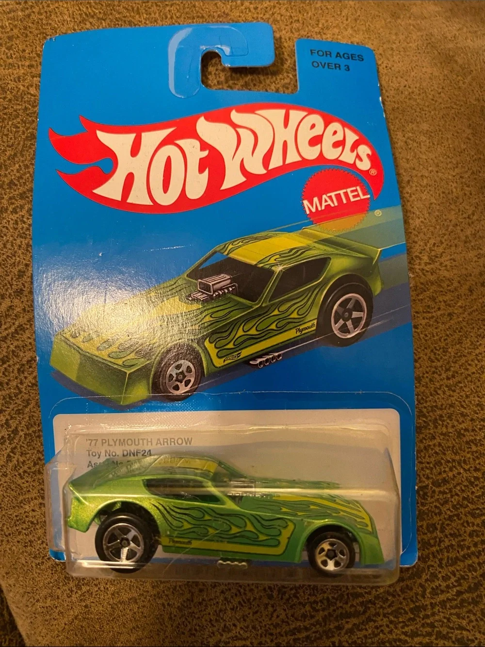 Mattel Hot Wheels Metallic Green Plymouth Arrow with Black Flame Graphics DC2